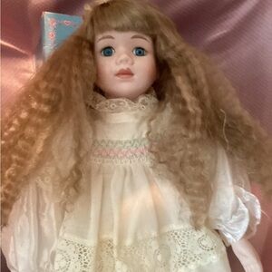 Charming Porcelain Doll with Curly Blonde Hair and Lace Dress
